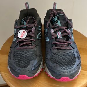 New Balance, gray, purple and violet ladies size 7 wide shoe. Never worn.